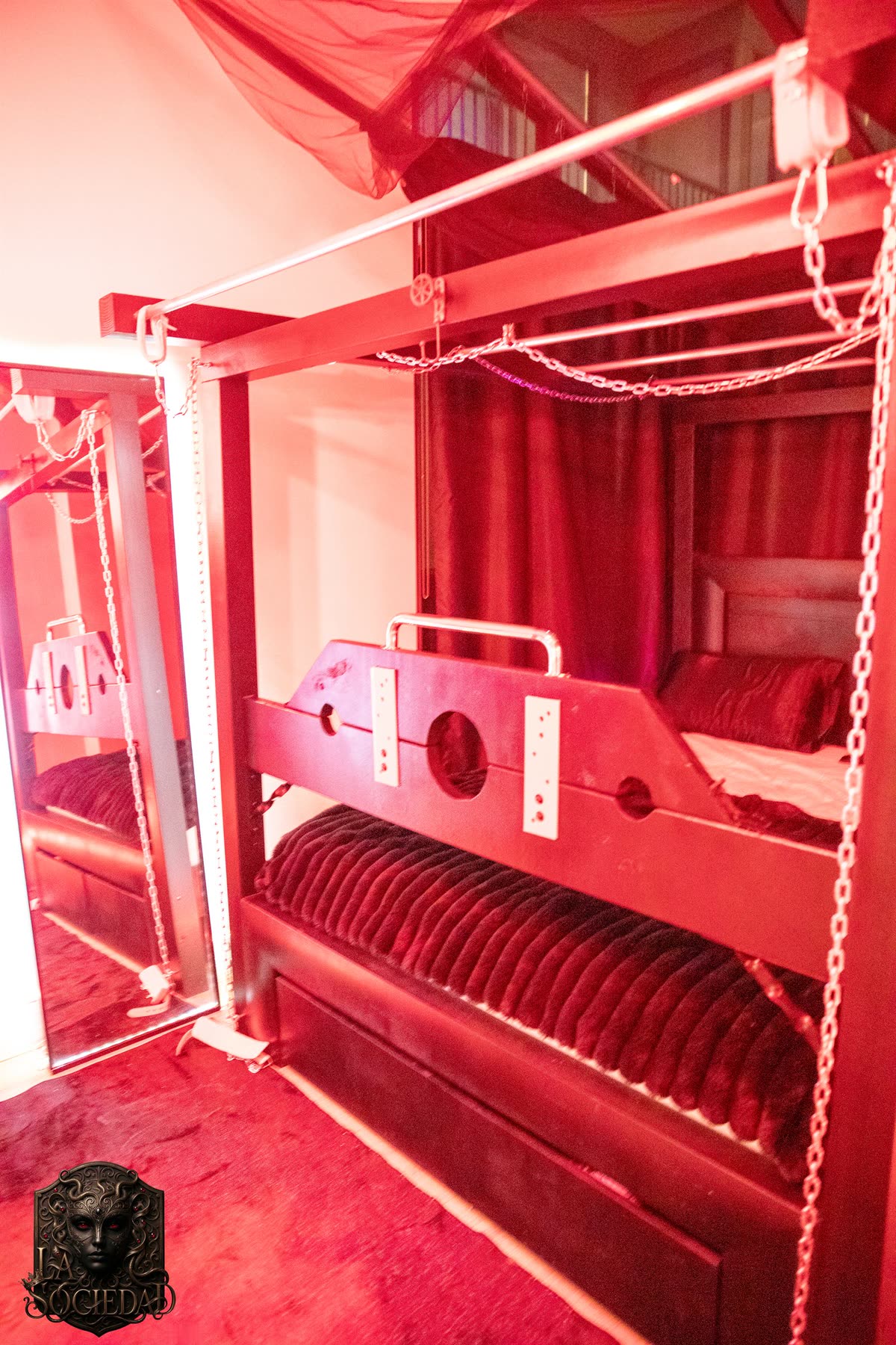 The Red Room frame, its chains, and the mirror beside it